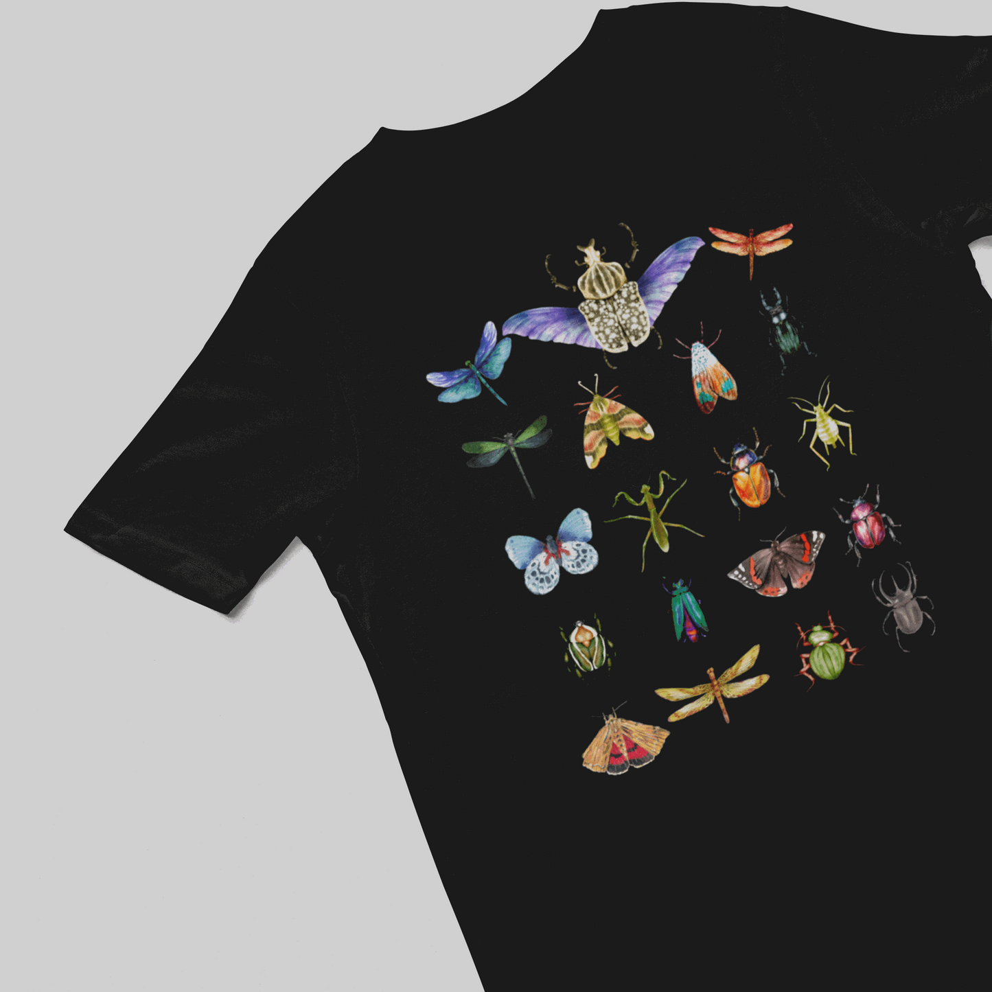 Bugs Entomology Insects T-shirt Cool Watercolour Bug and Beetle Shirt featuring a nature-inspired insect design, crafted from soft, breathable 100% Airlume combed cotton. Perfect for outdoor activities like hiking, camping, and wildlife watching, as well as casual wear. Eco-friendly production by Bella+Canvas with durable ribbed collars and tear-away label for ultimate comfort