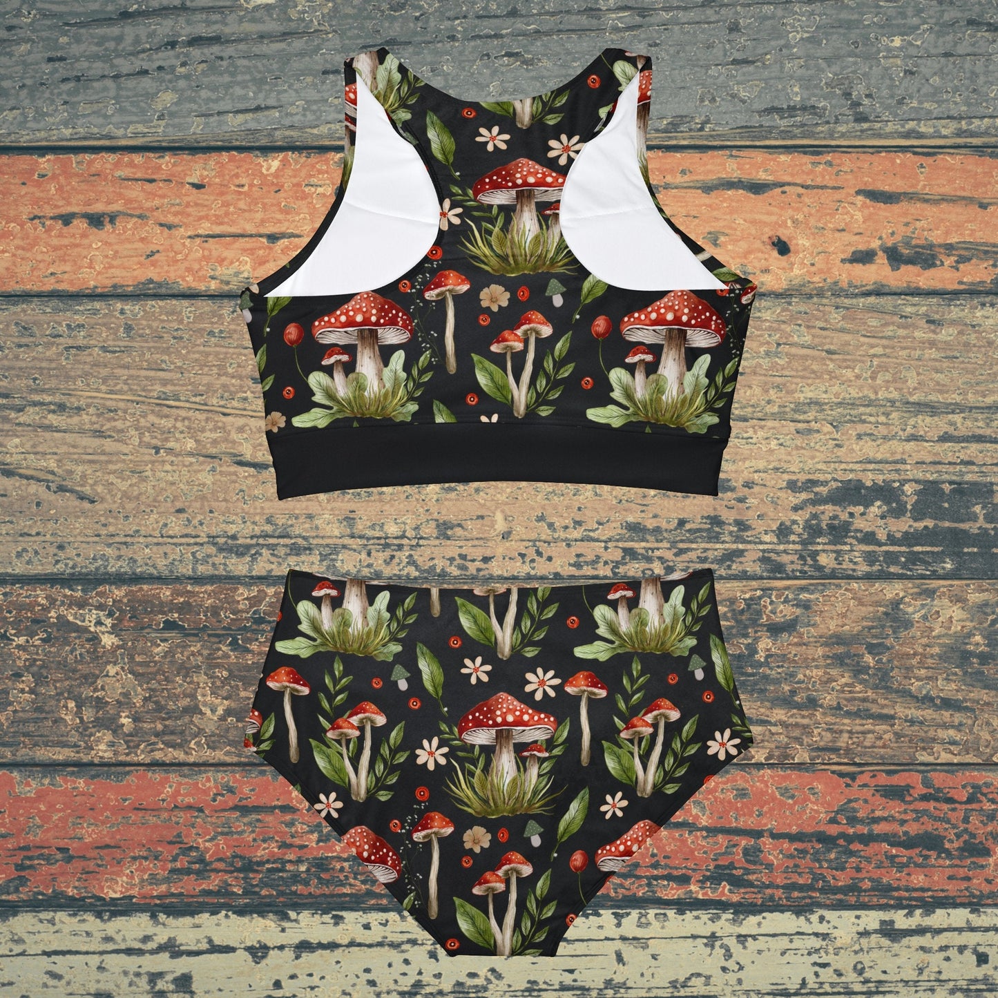 Cottagecore-inspired bikini set featuring a whimsical mushroom print. The swimwear has a botanical theme with witchy vibes, offering a charming and natural aesthetic. The bikini includes both top and bottom pieces, designed for a comfortable fit, perfect for nature lovers and those who embrace a cottagecore style.