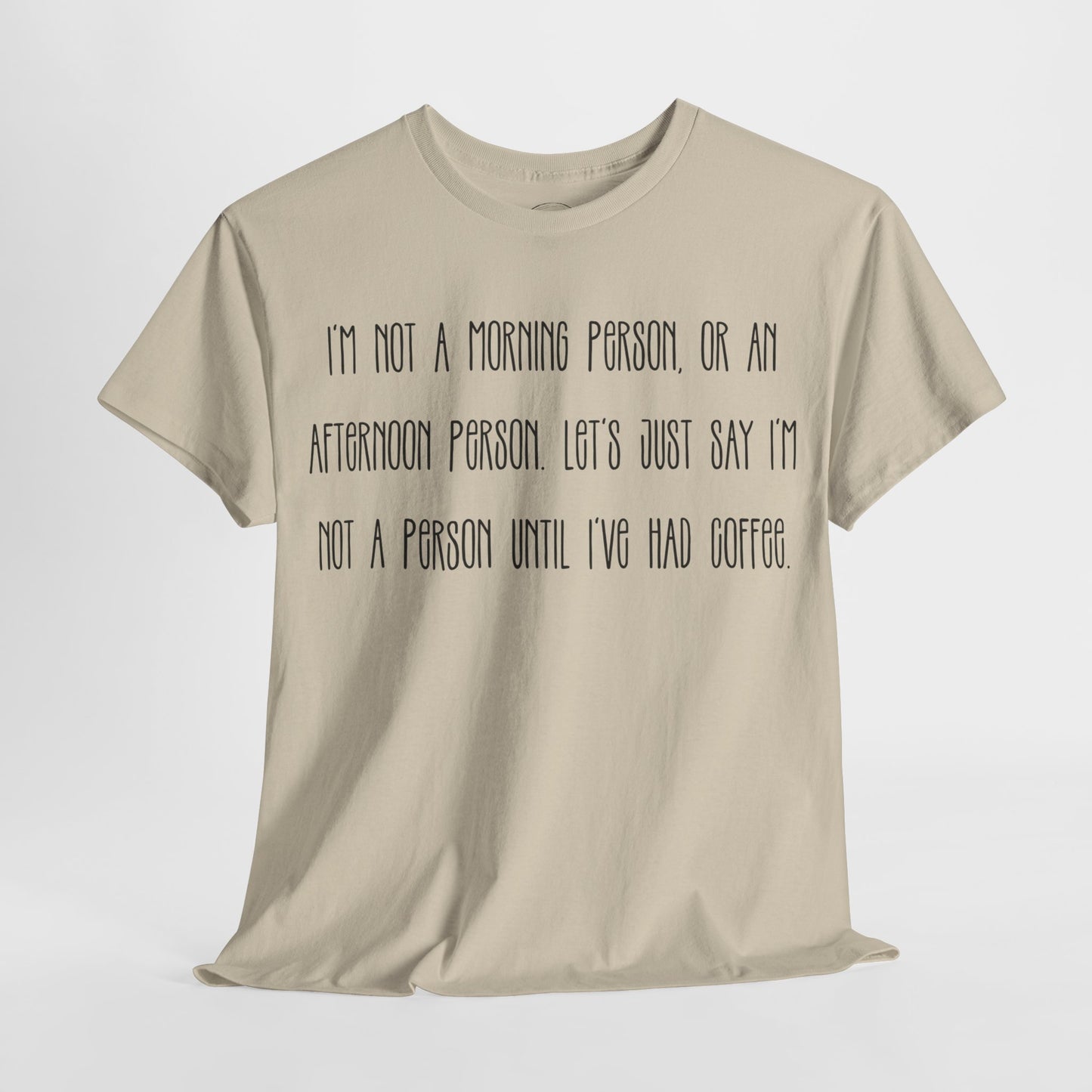 Not a Person Until I've Had Coffee t-shirt featuring a bold, humorous graphic design perfect for coffee lovers and those who aren't morning people. This funny shirt is made from soft, breathable fabric, ensuring comfort and style for casual wear. Ideal as a gift for coffee enthusiasts, this humor t-shirt showcases your love for caffeine and adds personality to your wardrobe