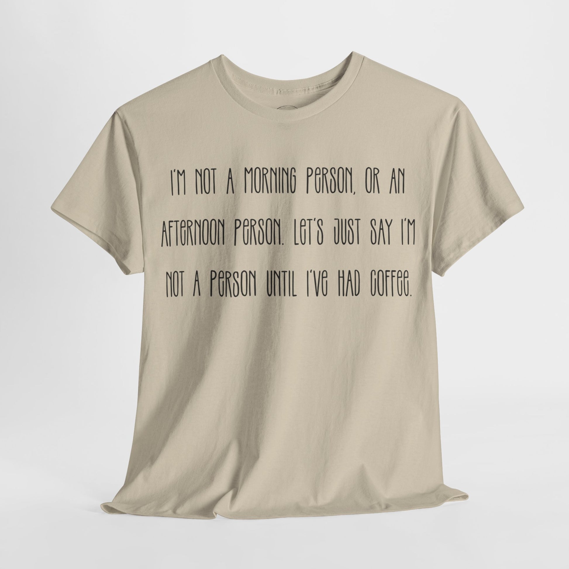 Not a Person Until I've Had Coffee t-shirt featuring a bold, humorous graphic design perfect for coffee lovers and those who aren't morning people. This funny shirt is made from soft, breathable fabric, ensuring comfort and style for casual wear. Ideal as a gift for coffee enthusiasts, this humor t-shirt showcases your love for caffeine and adds personality to your wardrobe