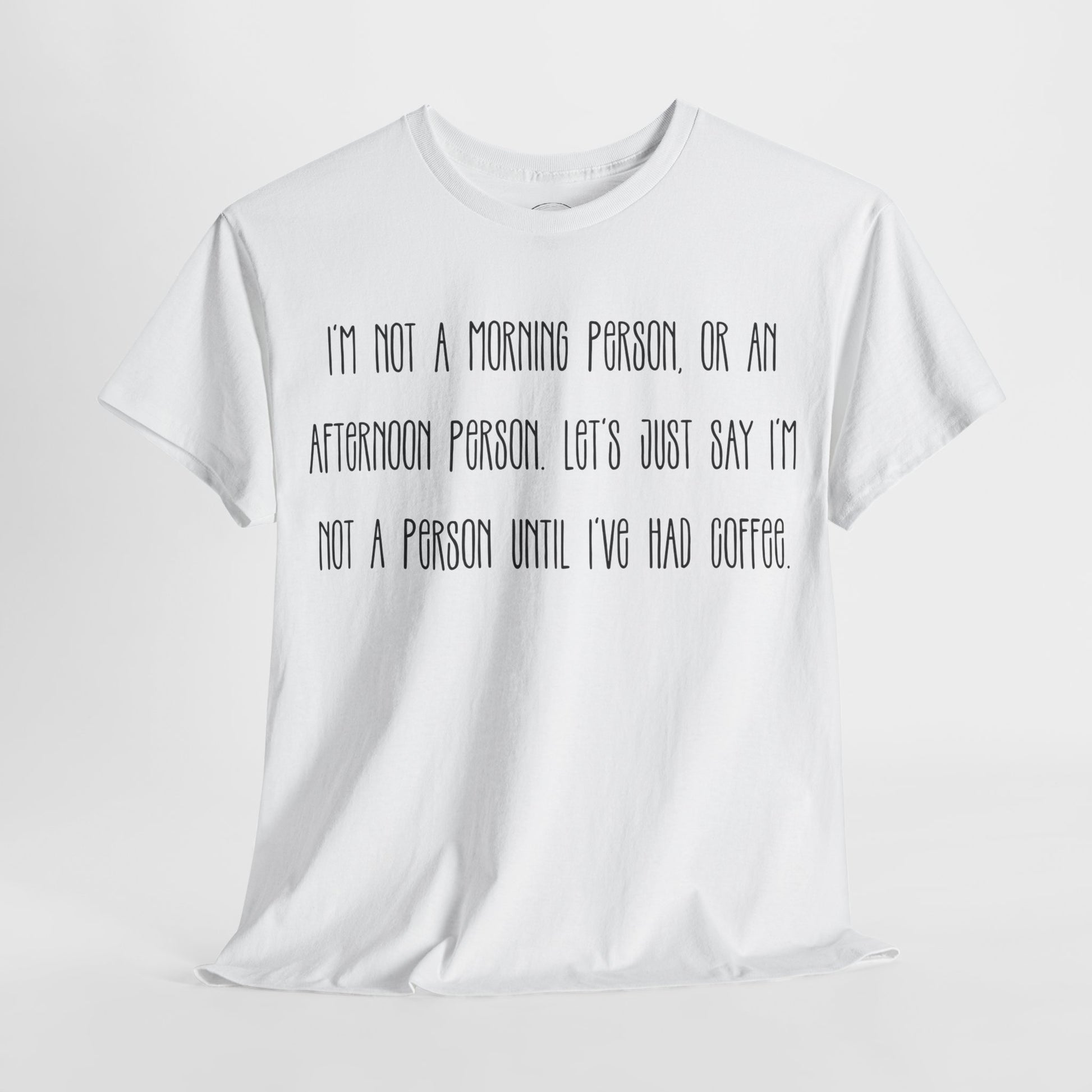 Not a Person Until I've Had Coffee t-shirt featuring a bold, humorous graphic design perfect for coffee lovers and those who aren't morning people. This funny shirt is made from soft, breathable fabric, ensuring comfort and style for casual wear. Ideal as a gift for coffee enthusiasts, this humor t-shirt showcases your love for caffeine and adds personality to your wardrobe