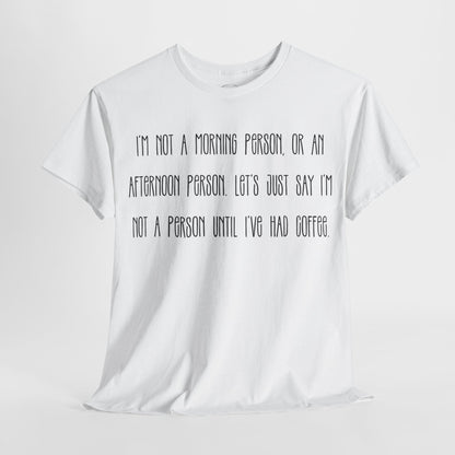 Not a Person Until I've Had Coffee t-shirt featuring a bold, humorous graphic design perfect for coffee lovers and those who aren't morning people. This funny shirt is made from soft, breathable fabric, ensuring comfort and style for casual wear. Ideal as a gift for coffee enthusiasts, this humor t-shirt showcases your love for caffeine and adds personality to your wardrobe