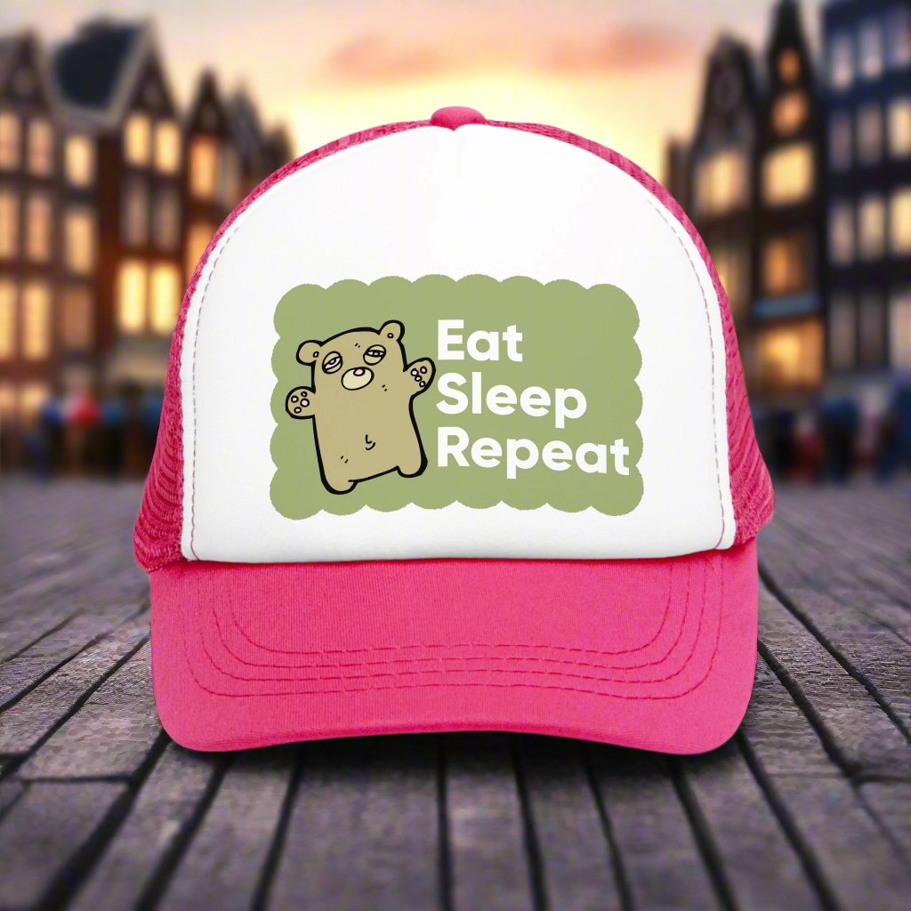 Retro vintage-style trucker hat with the text 'Eat Sleep Repeat' printed on the front. This snapback cap is designed for both men and women, featuring a distressed look and mesh back for a classic, funny style. Ideal as a silly gag gift for adults who enjoy humorous fashion accessories.