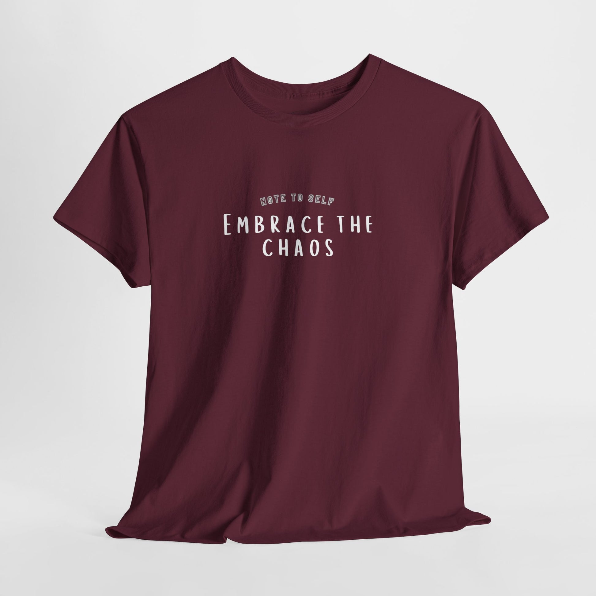 Embrace the Chaos cotton t-shirt featuring a minimalist graphic design, crafted from 100% medium-weight cotton for comfort and durability. This unisex classic fit tee is perfect for casual wear and adds a humorous touch to any outfit. Ethically produced and eco-friendly, this stylish t-shirt is ideal for those who appreciate quality and sustainability."