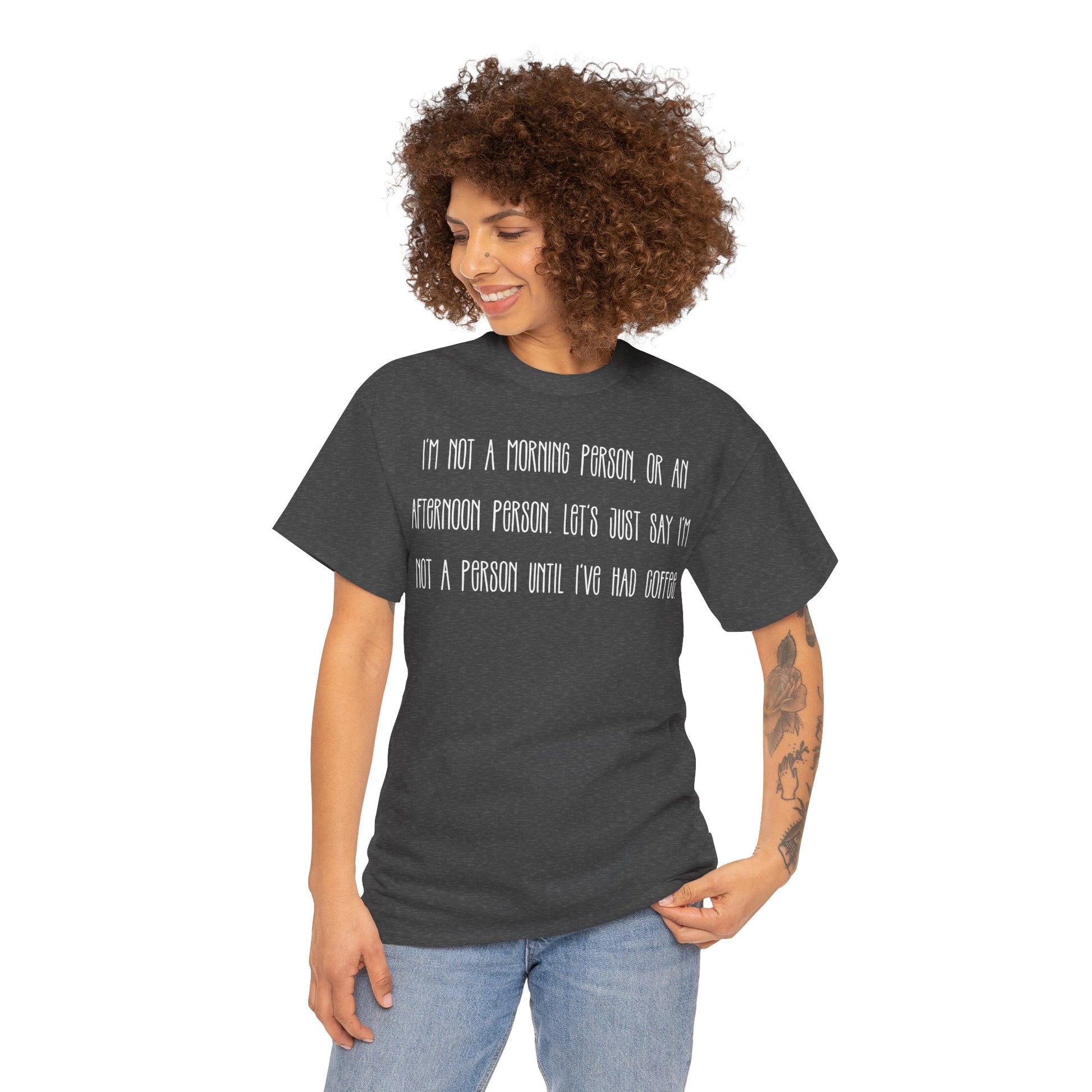 Not a Person Until I've Had Coffee t-shirt featuring a bold, humorous graphic design perfect for coffee lovers and those who aren't morning people. This funny shirt is made from soft, breathable fabric, ensuring comfort and style for casual wear. Ideal as a gift for coffee enthusiasts, this humor t-shirt showcases your love for caffeine and adds personality to your wardrobe