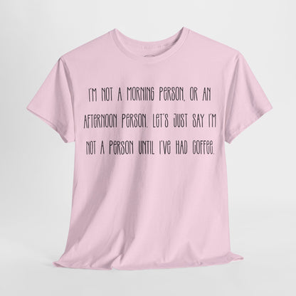 Not a Person Until I've Had Coffee t-shirt featuring a bold, humorous graphic design perfect for coffee lovers and those who aren't morning people. This funny shirt is made from soft, breathable fabric, ensuring comfort and style for casual wear. Ideal as a gift for coffee enthusiasts, this humor t-shirt showcases your love for caffeine and adds personality to your wardrobe.