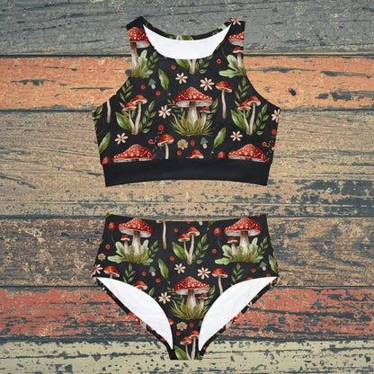 Cottagecore-inspired bikini set featuring a whimsical mushroom print. The swimwear has a botanical theme with witchy vibes, offering a charming and natural aesthetic. The bikini includes both top and bottom pieces, designed for a comfortable fit, perfect for nature lovers and those who embrace a cottagecore style.