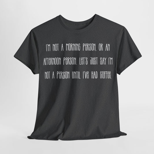 Not a Person Until I've Had Coffee t-shirt featuring a bold, humorous graphic design perfect for coffee lovers and those who aren't morning people. This funny shirt is made from soft, breathable fabric, ensuring comfort and style for casual wear. Ideal as a gift for coffee enthusiasts, this humor t-shirt showcases your love for caffeine and adds personality to your wardrobe.