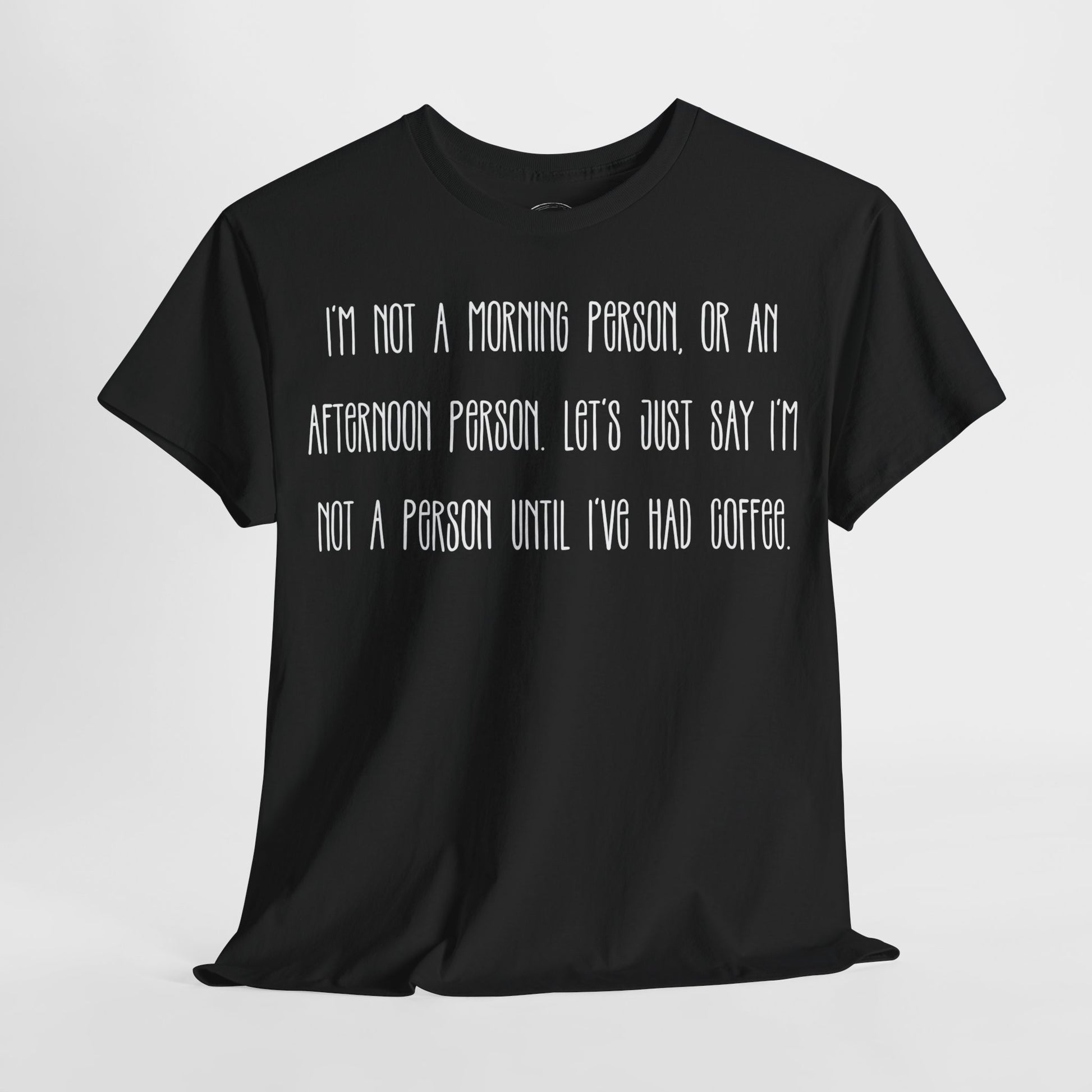 Not a Person Until I've Had Coffee t-shirt featuring a bold, humorous graphic design perfect for coffee lovers and those who aren't morning people. This funny shirt is made from soft, breathable fabric, ensuring comfort and style for casual wear. Ideal as a gift for coffee enthusiasts, this humor t-shirt showcases your love for caffeine and adds personality to your wardrobe.