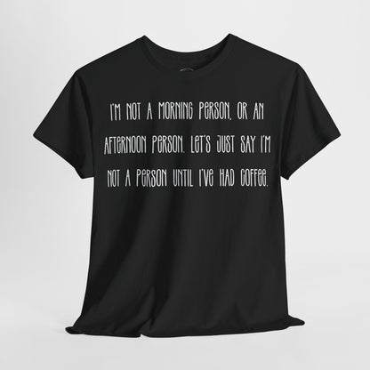 Not a Person Until I've Had Coffee t-shirt featuring a bold, humorous graphic design perfect for coffee lovers and those who aren't morning people. This funny shirt is made from soft, breathable fabric, ensuring comfort and style for casual wear. Ideal as a gift for coffee enthusiasts, this humor t-shirt showcases your love for caffeine and adds personality to your wardrobe.