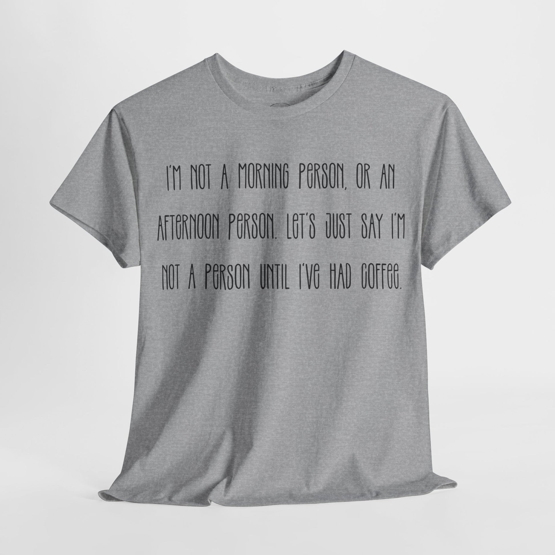 Not a Person Until I've Had Coffee t-shirt featuring a bold, humorous graphic design perfect for coffee lovers and those who aren't morning people. This funny shirt is made from soft, breathable fabric, ensuring comfort and style for casual wear. Ideal as a gift for coffee enthusiasts, this humor t-shirt showcases your love for caffeine and adds personality to your wardrobe