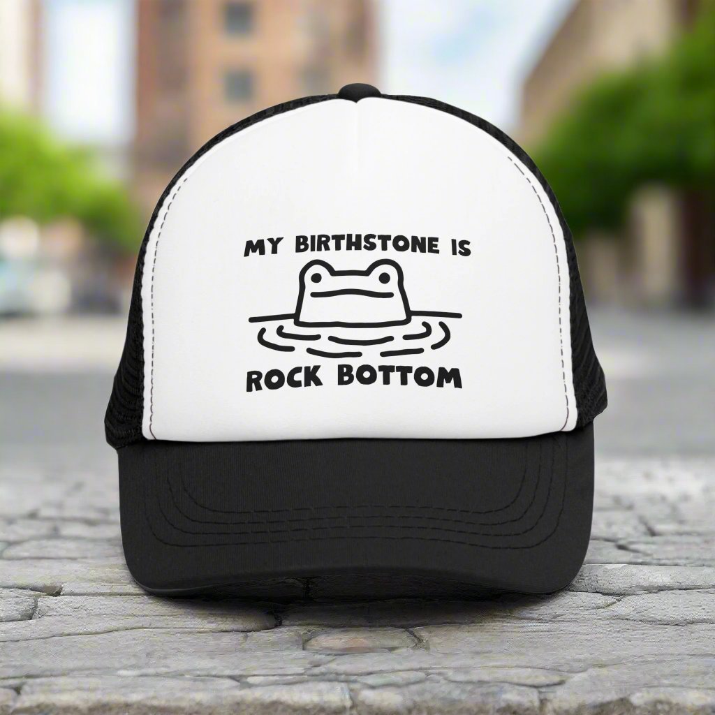 Rockbottom Trucker Cap with a vintage-style snapback design and breathable mesh back. This adjustable retro hat offers a trendy, classic look, perfect for everyday wear. Ideal for men seeking a stylish and comfortable snapback, it adds a touch of vintage flair to any casual outfit.
