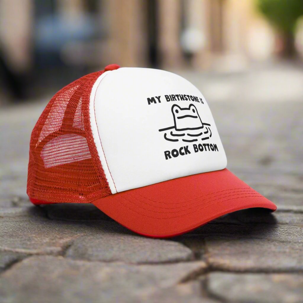 Rockbottom Trucker Cap with a vintage-style snapback design and breathable mesh back. This adjustable retro hat offers a trendy, classic look, perfect for everyday wear. Ideal for men seeking a stylish and comfortable snapback, it adds a touch of vintage flair to any casual outfit.