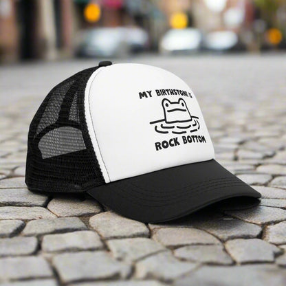 Rockbottom Trucker Cap with a vintage-style snapback design and breathable mesh back. This adjustable retro hat offers a trendy, classic look, perfect for everyday wear. Ideal for men seeking a stylish and comfortable snapback, it adds a touch of vintage flair to any casual outfit.