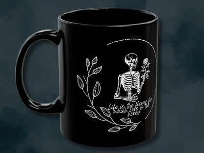 Trendy Skeleton Mug featuring a love quote with a gothic aesthetic. Perfect for coffee lovers who enjoy a spooky or whimsigoth vibe, this skeleton coffee mug makes a great gift for Halloween or year-round use. Add a touch of dark charm to your coffee routine with this unique and stylish mug.